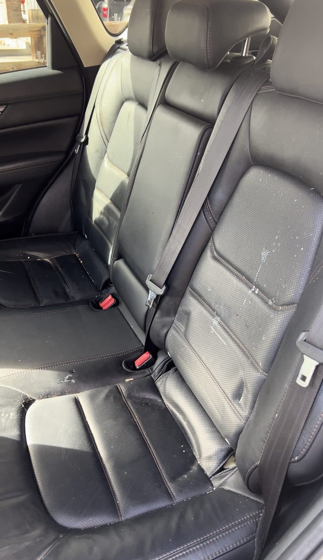 Before: black leather rear seat
